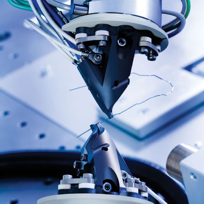 SureSmile arch wire being bent to fit a patient's teeth for faster orthodontic treatment