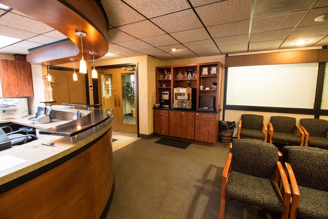 Ferri Orthodontics' Mt Pleasant office coffee station Friendly orthodontic front desk with coffee station at Ferri Orthodontics Mt Pleasant office, welcoming patients with a smile.