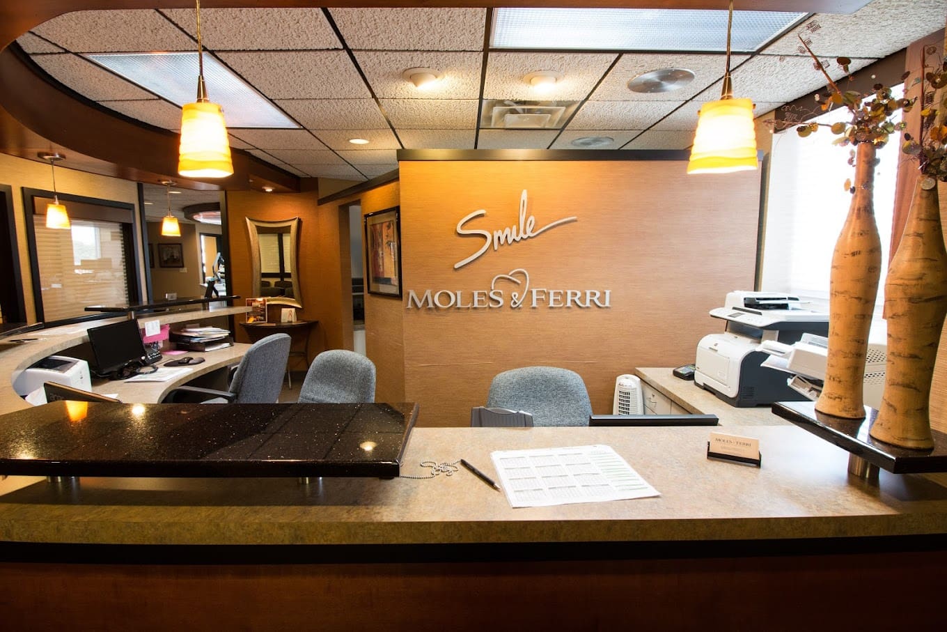 Ferri Orthodontics' Mt Pleasant office front desk Modern and inviting Mt Pleasant orthodontic office reception desk, perfect for scheduling appointments."